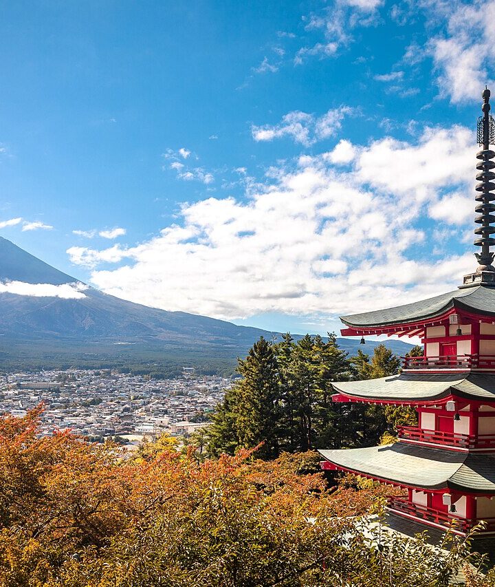 Chureito Pagoda overlooking Fujiyoshida with Mount Fuji in the distance.