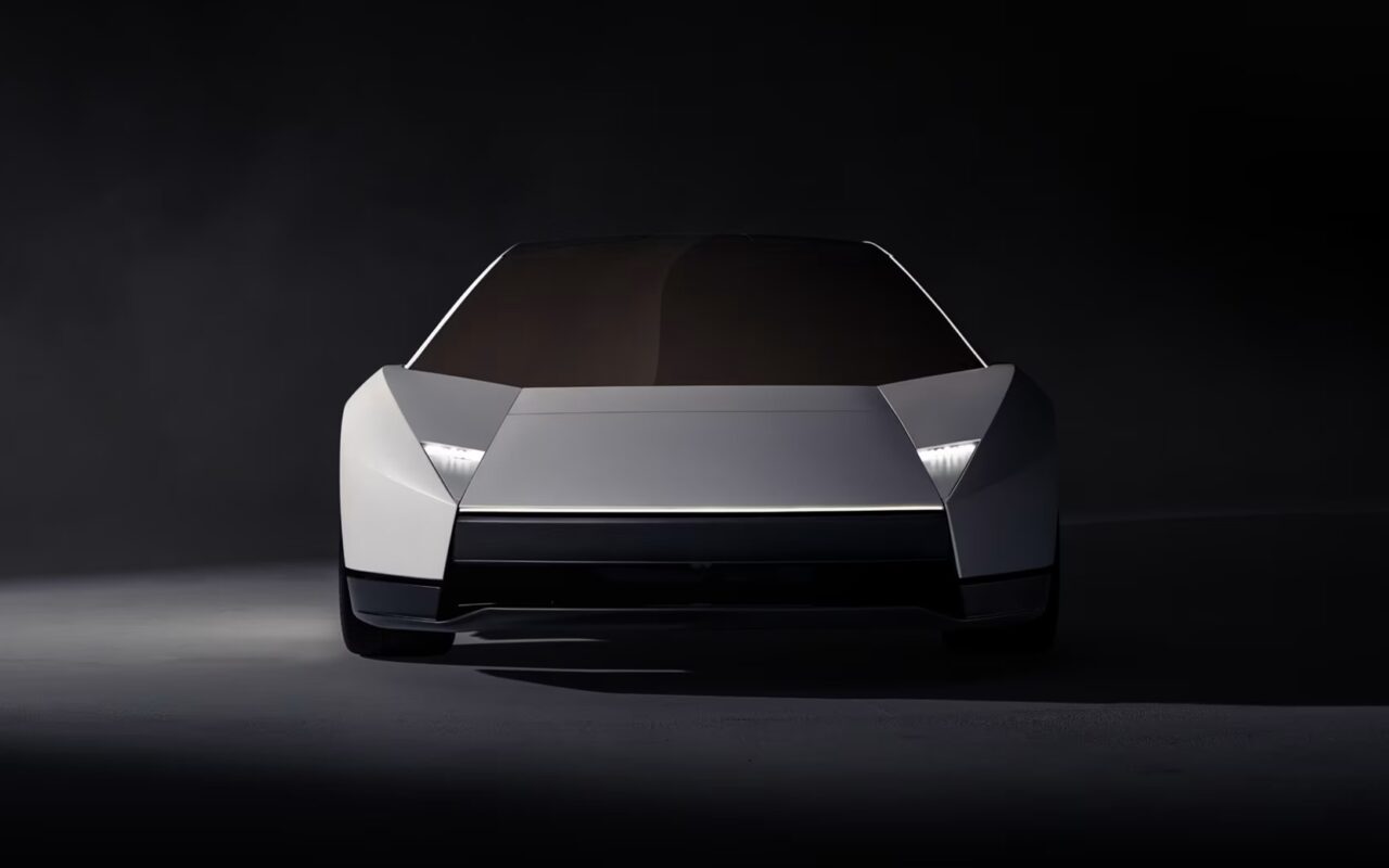 Front view of the redesigned silver Tesla Roadster with angular bodywork and narrow headlights.