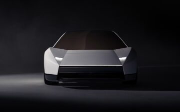 Front view of the redesigned silver Tesla Roadster with angular bodywork and narrow headlights.