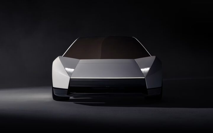 Front view of the redesigned silver Tesla Roadster with angular bodywork and narrow headlights.