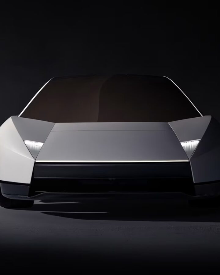 Front view of the redesigned silver Tesla Roadster with angular bodywork and narrow headlights.